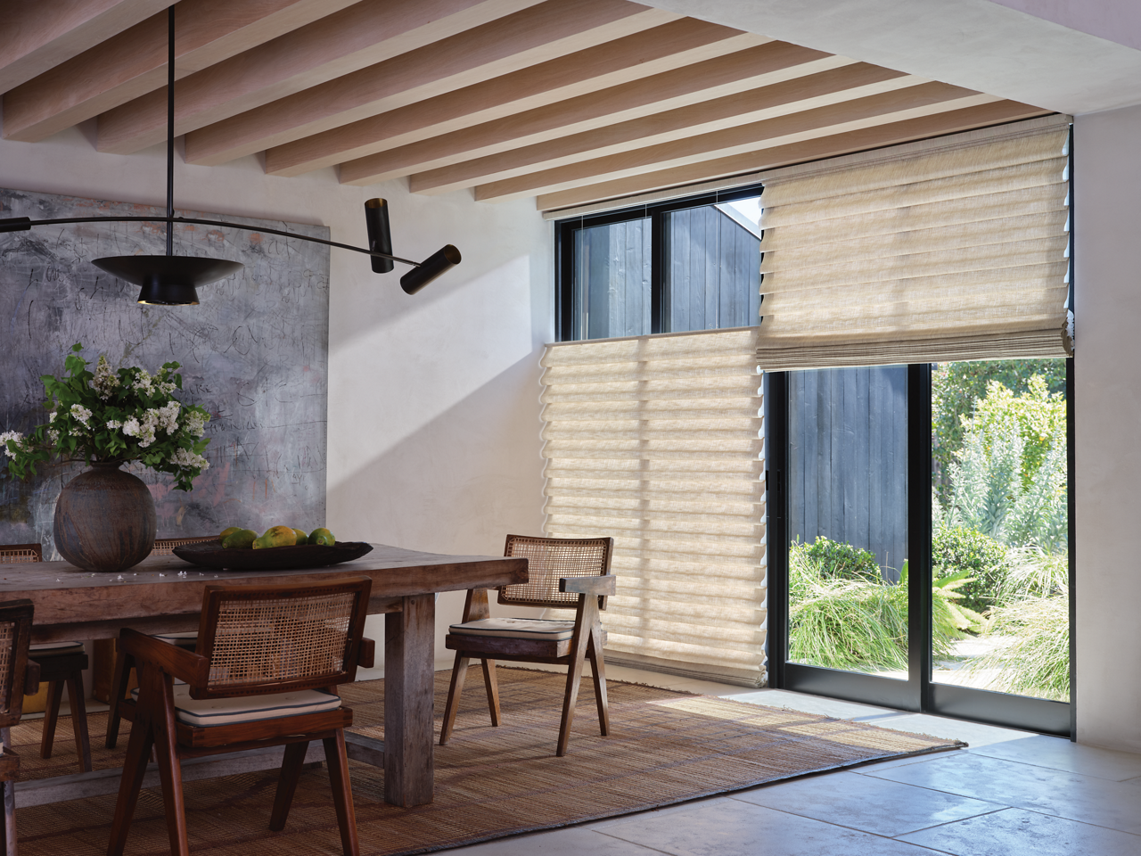 Dining room featuring picture windows with Vignette Modern Roman Shades running bottom to top and top to bottom.